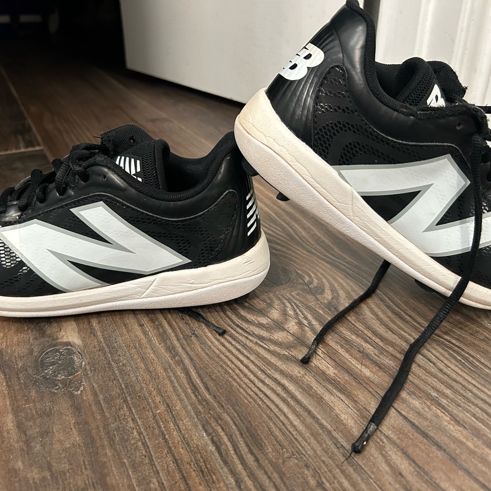 New Balance Black and White baseball cleats